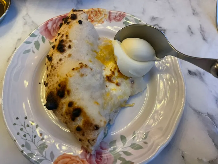 Quattro formaggi pizza topped with hamon and cream cheese