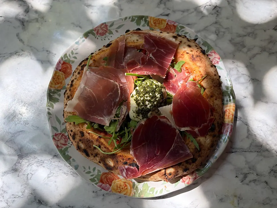 Burrata cheese piled on top of the pizza