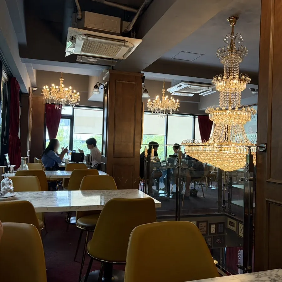 Second floor with a chandelier and window seats