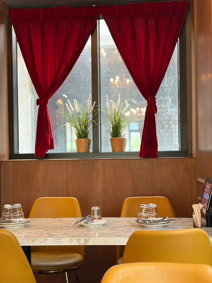 Restaurant interior with second-floor window seating