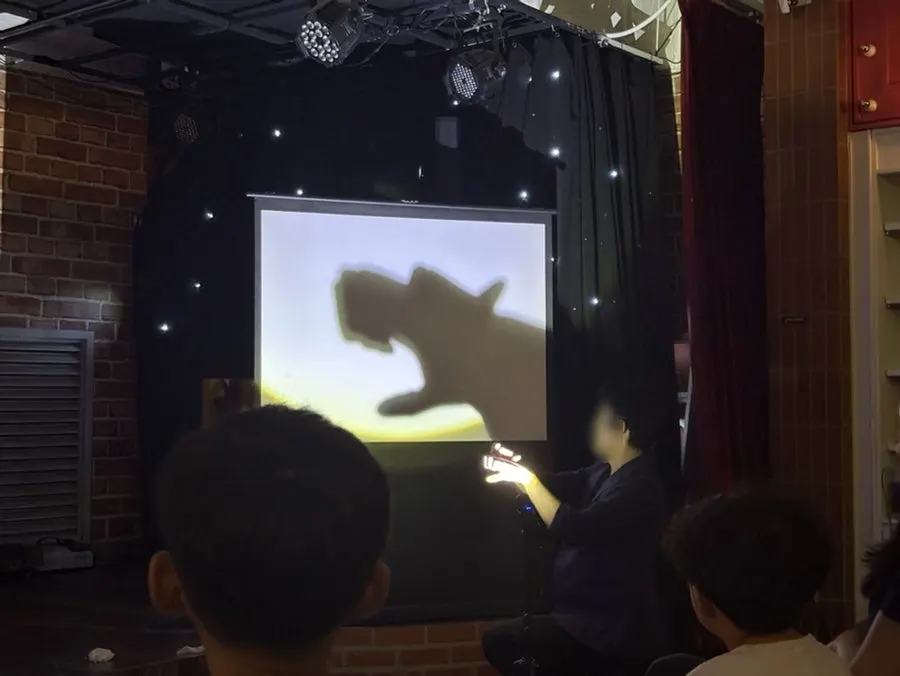 A children's magic trick featuring a bird and goldfish