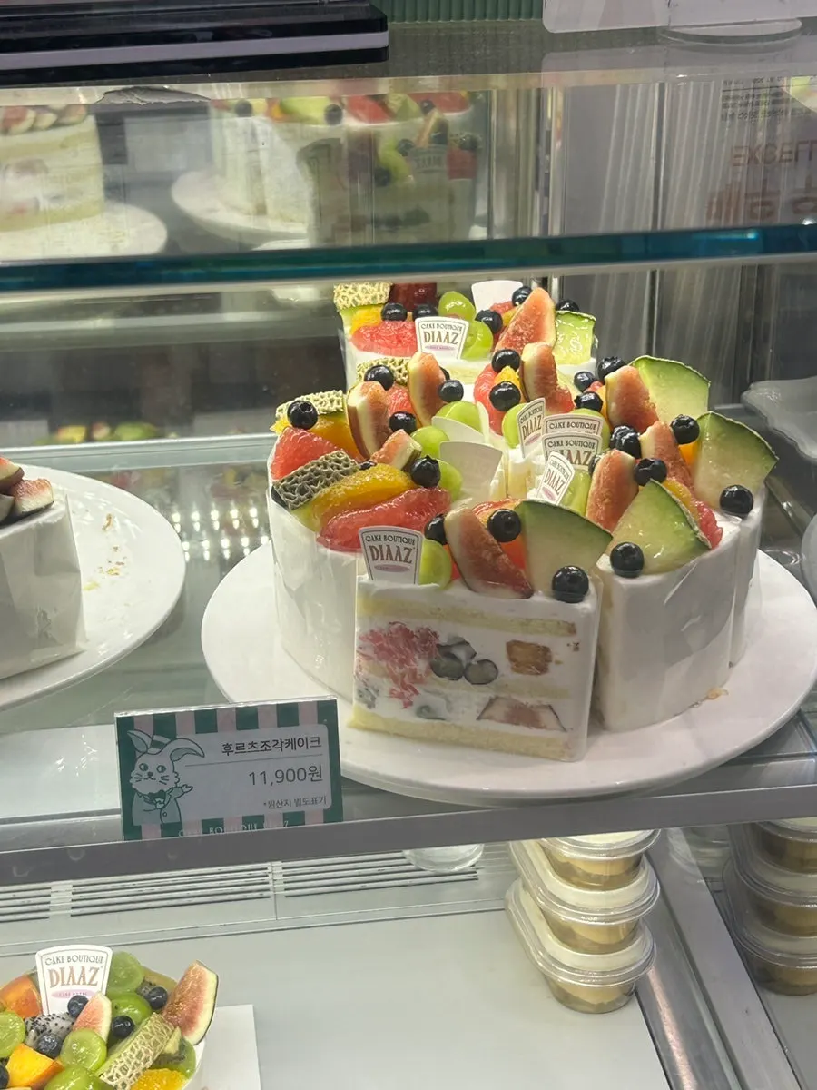 Display case with fruit cakes