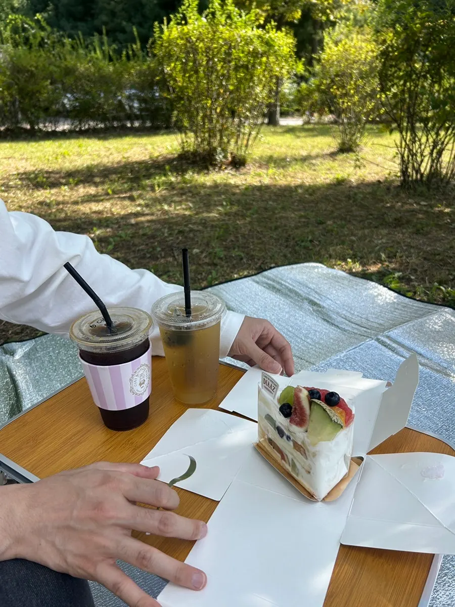 Table with fruit cake and americano together