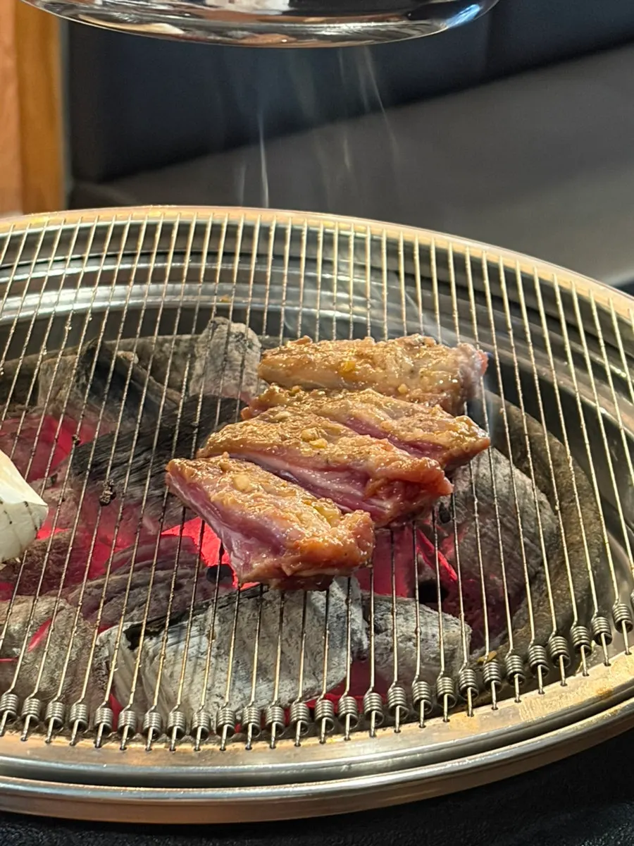 Shoulder rack with bone wrapped in tissue, set on a plate