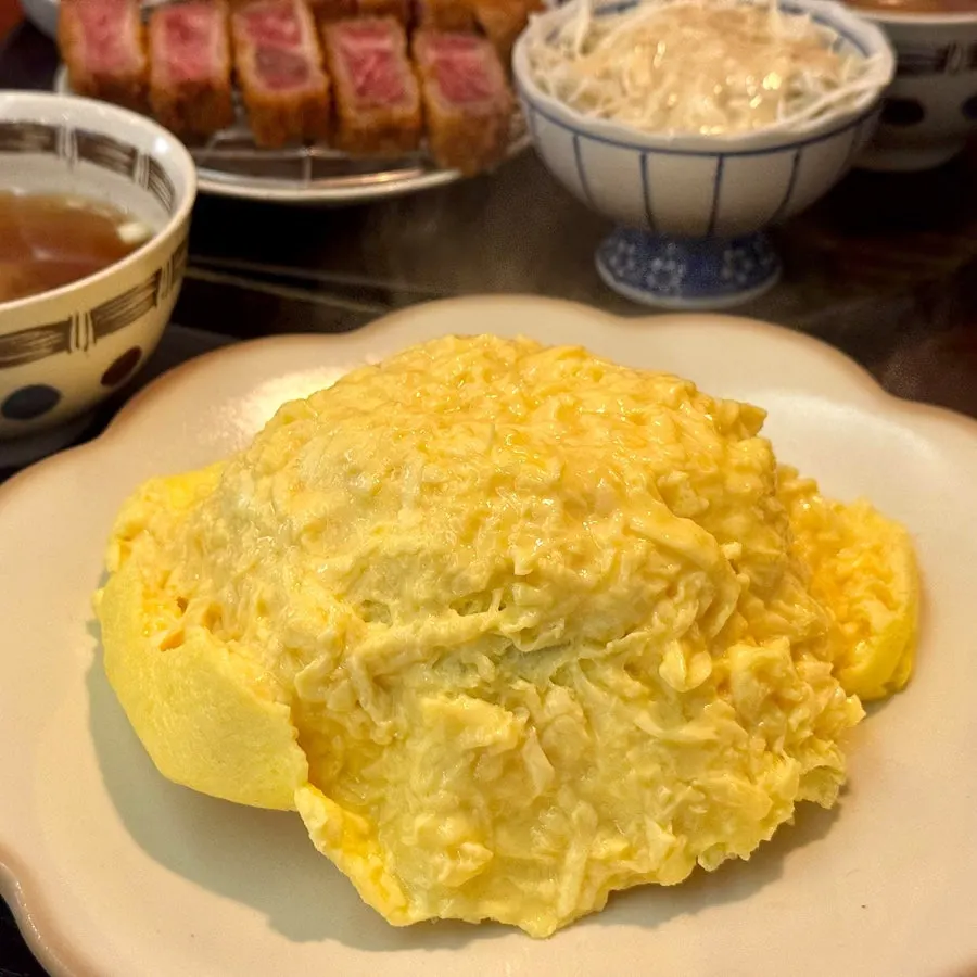 Omurice opened to reveal soft egg