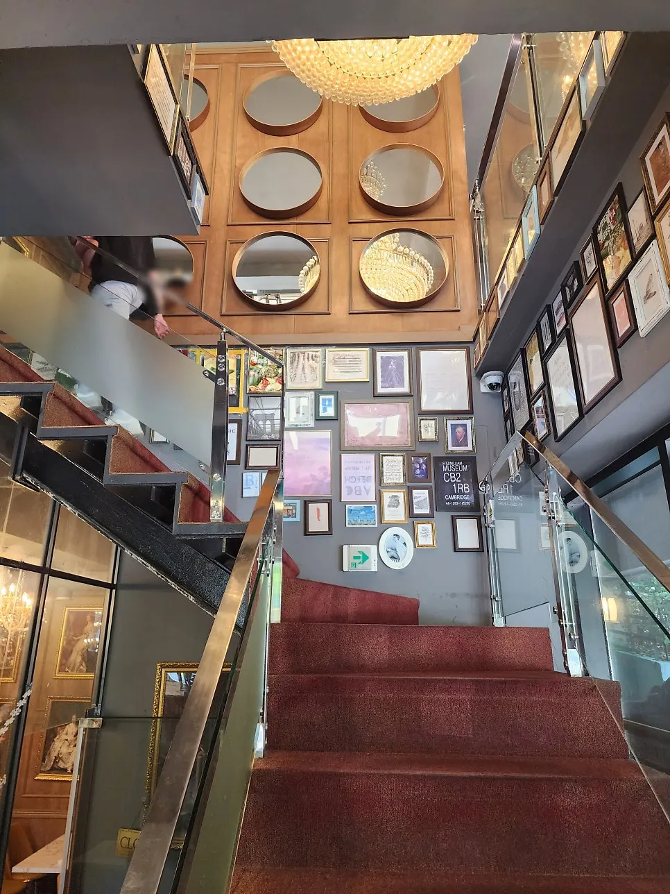 2nd-floor staircase lined with European-style frames
