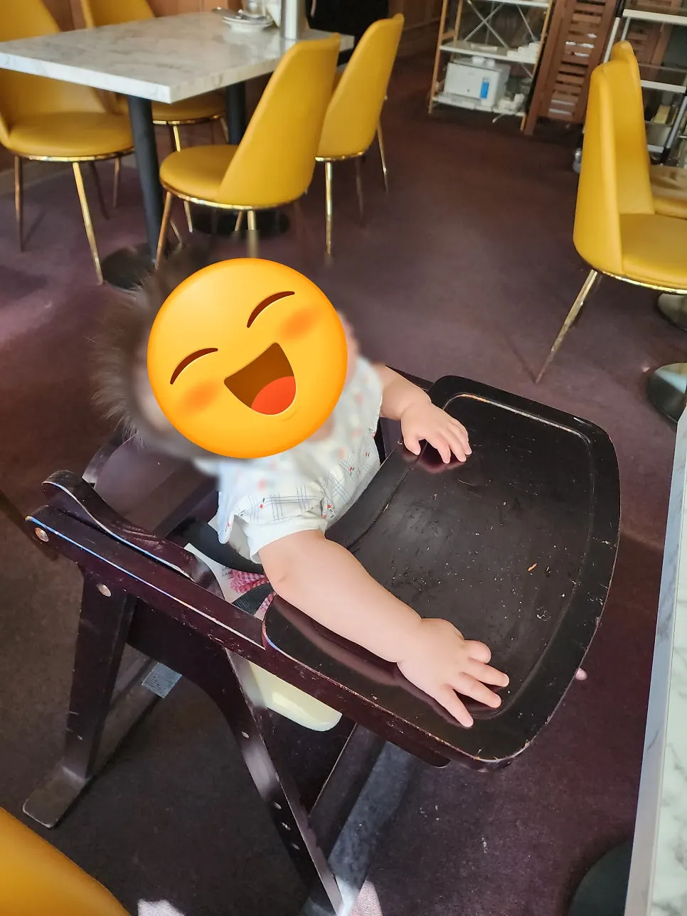 Baby sitting in the baby chair waiting for food