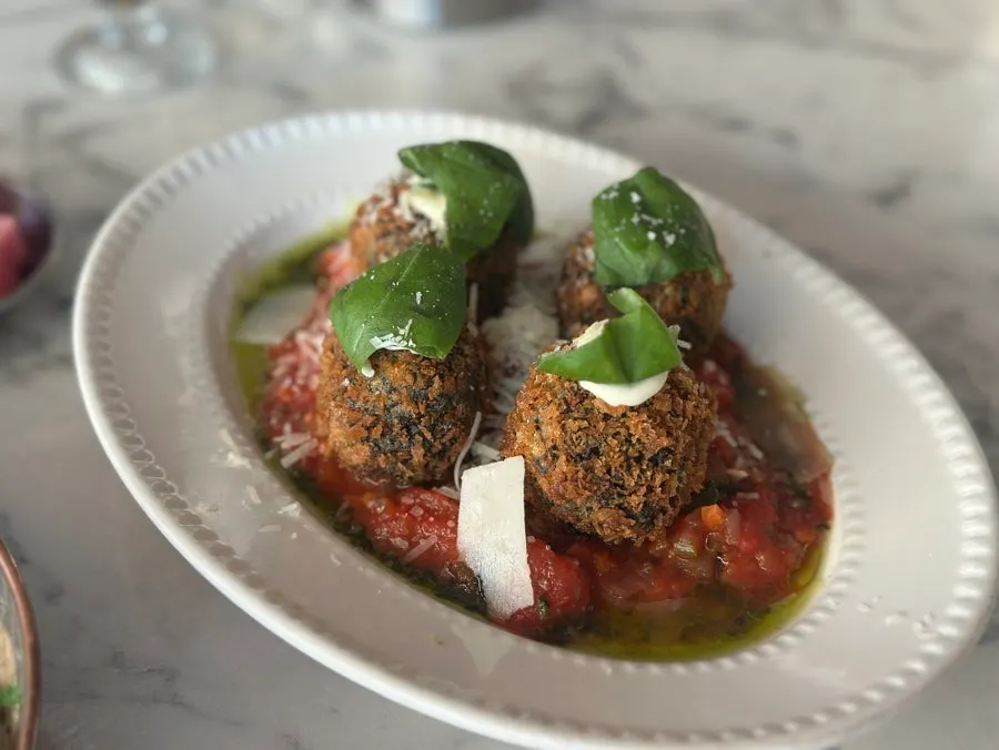 A plate of squid ink arancini at The European Gwanggyo