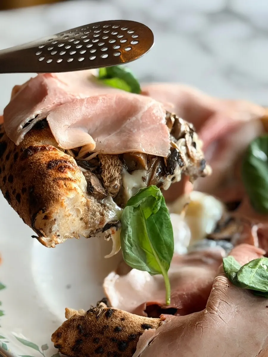 Photo of pizza with truffle and mushroom flavors