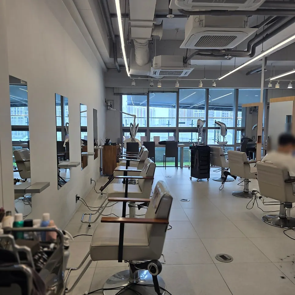Spacious salon interior with white-toned decor