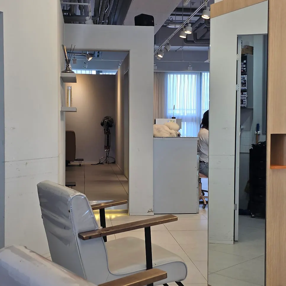 Row of brown leather shampoo chairs