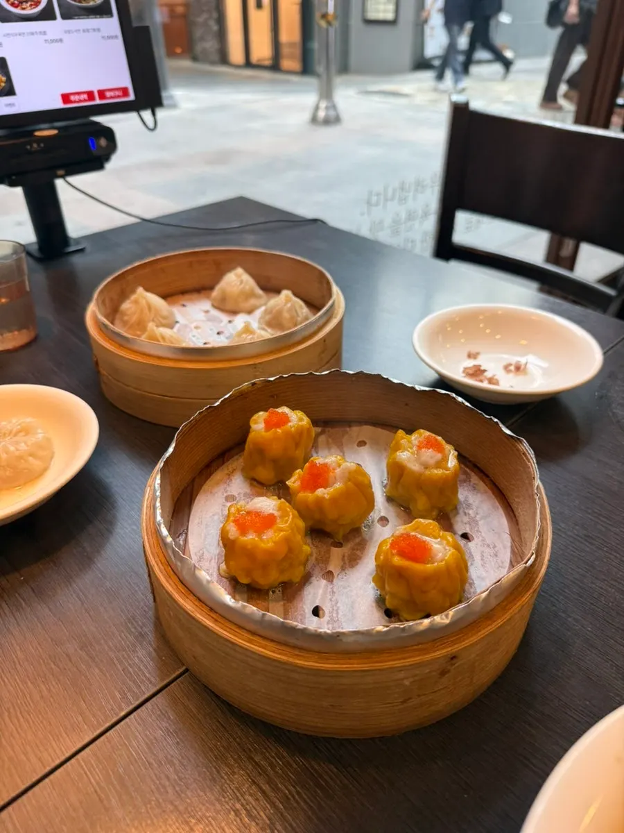 A spread of shrimp shumai and dim sum