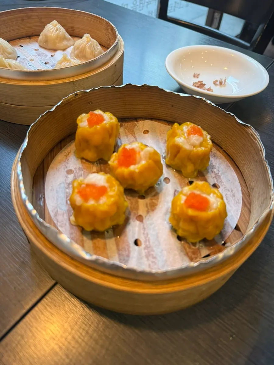 Lunch table with uyuk dosakmyeon and dim sum served together
