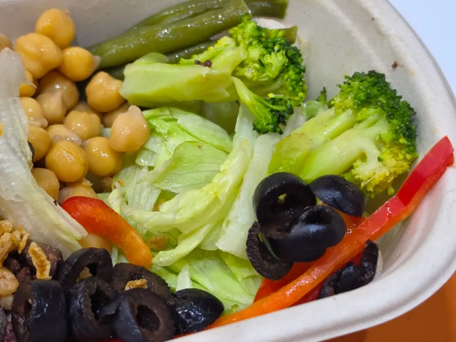 Vegetables and chickpeas drizzled with oriental sauce