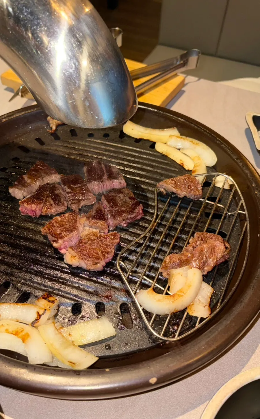 Black beef sirloin grilling on the tabletop grill