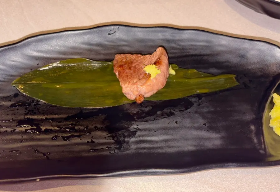 Sirloin topped with wasabi wrapped in myeongi namul