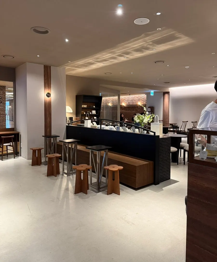 Wood-toned, beige interior of Center Coffee Gwanghwamun