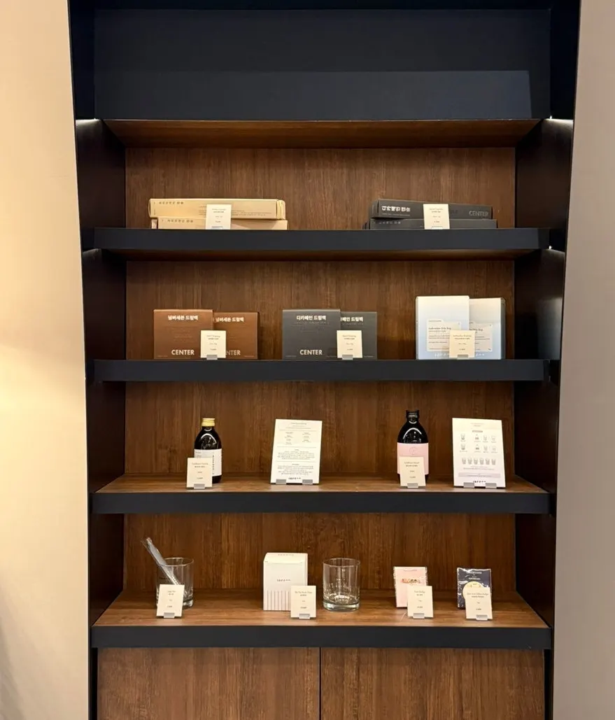 Shelf of Center Coffee goods including drip bags and cold brew