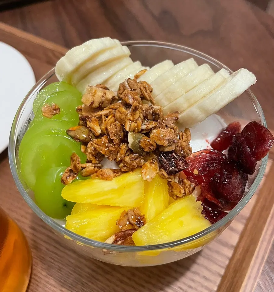 Greek yogurt topped with granola and shine muscat grapes