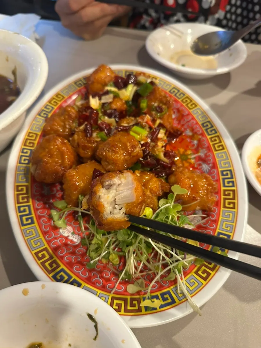 Crispy kkanpunggi topped with chili peppers