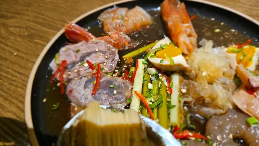 Soy-marinated shrimp and abalone served with rice