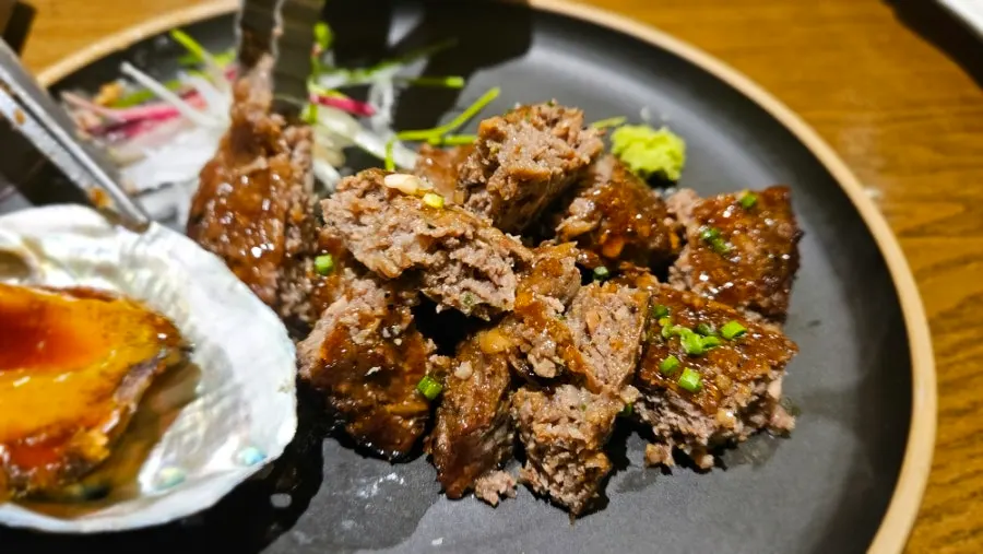 Moist tteokgalbi served with abalone