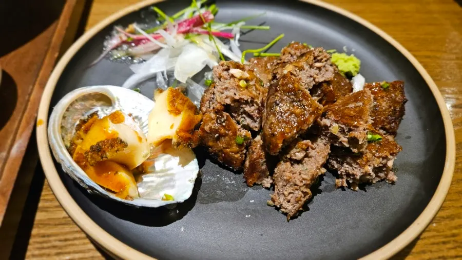 Abalone tteokgalbi with rice and side dishes