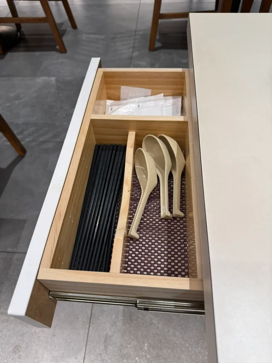 Self-serve chopsticks and wet wipes in the holder