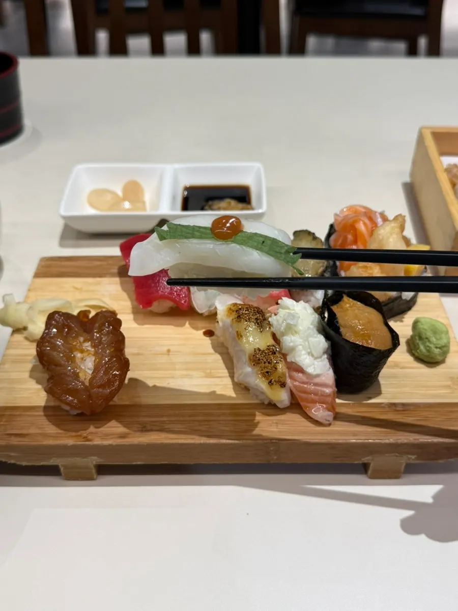 Hamachi sushi topped with shiso