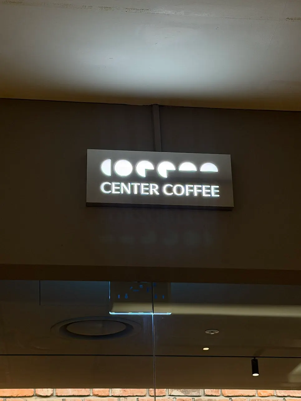 Center Coffee storefront with floor-to-ceiling windows