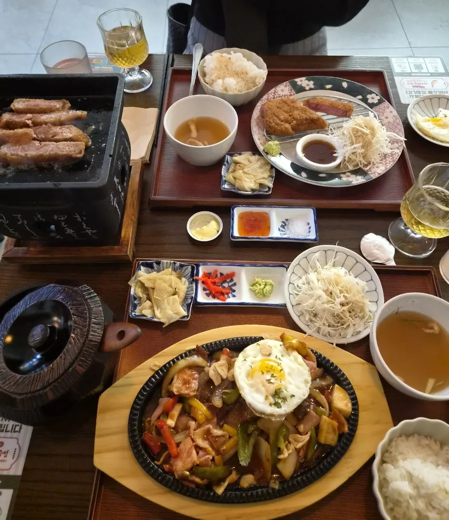 Table spread of ordered gyukatsu and hot-plate chop steak