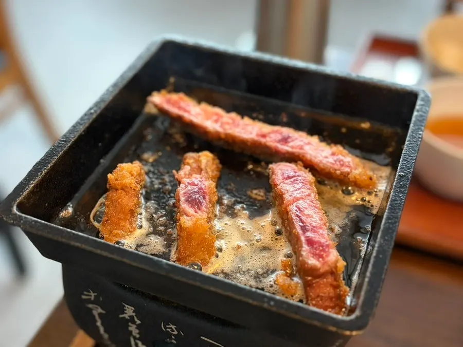 Close-up of gyukatsu with a bright red cross-section