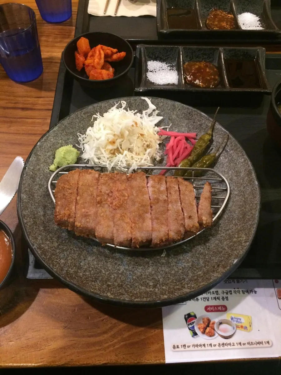 Gyukatsu set served with soup, rice, and side dishes