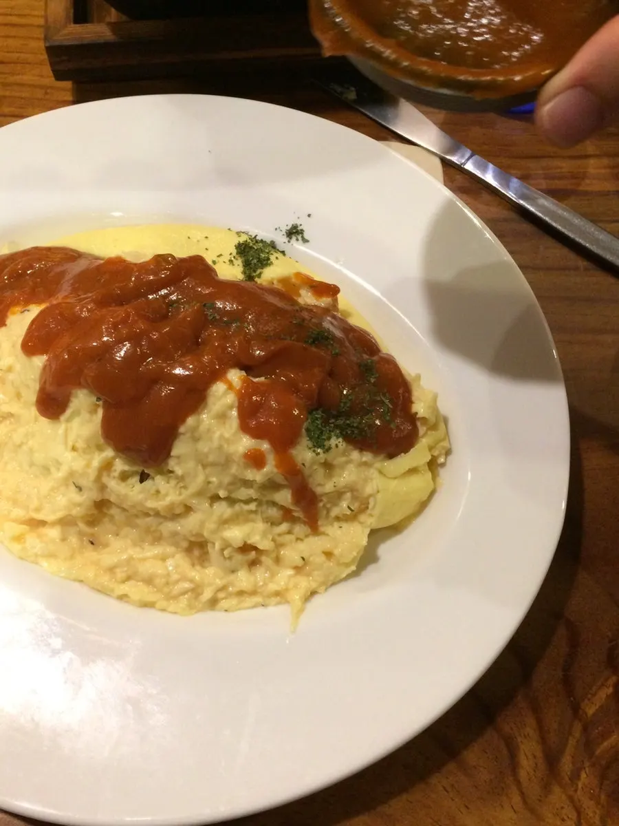 Omurice with sauce poured over it