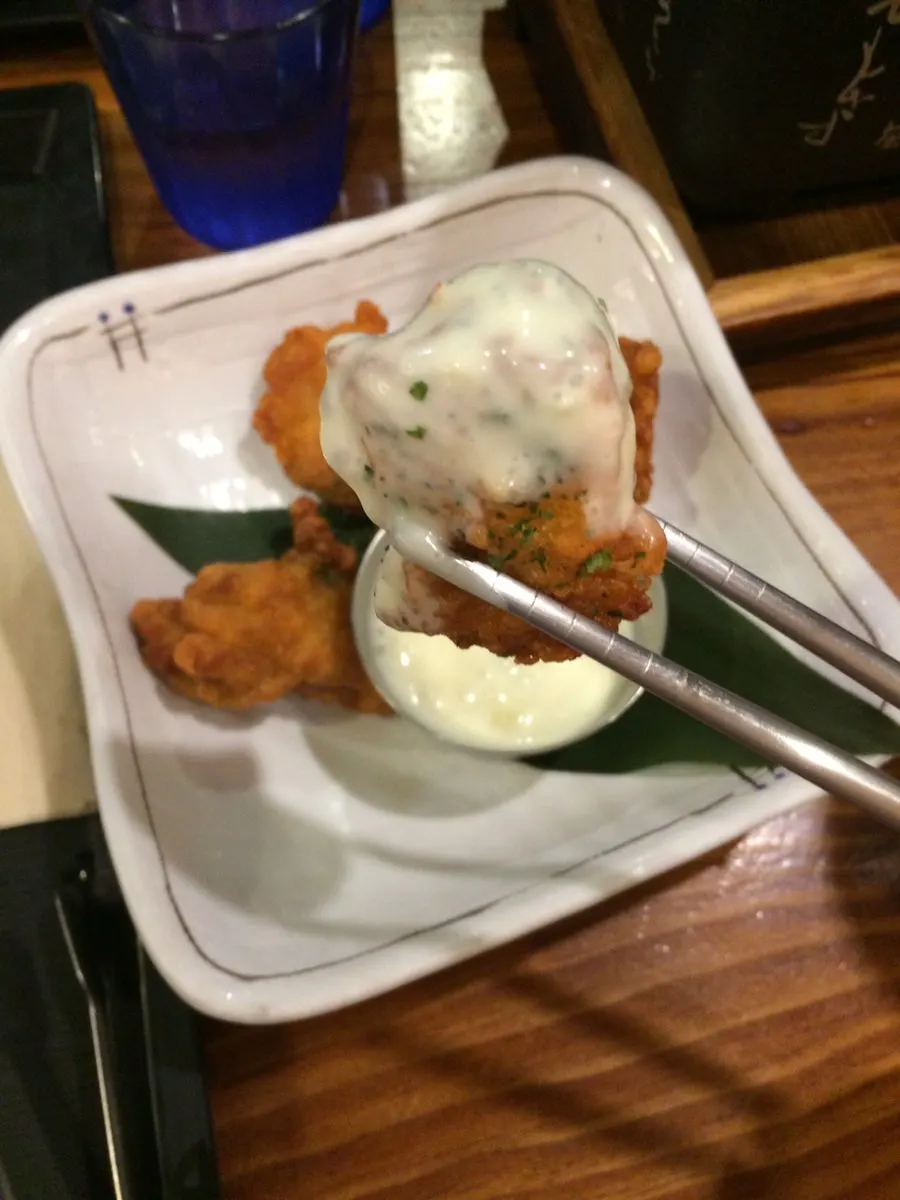 Karaage served alongside sauce