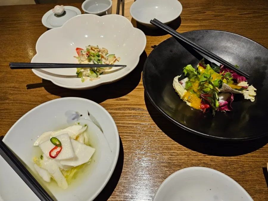 Mung bean porridge and yuzu dressing salad served as appetizers