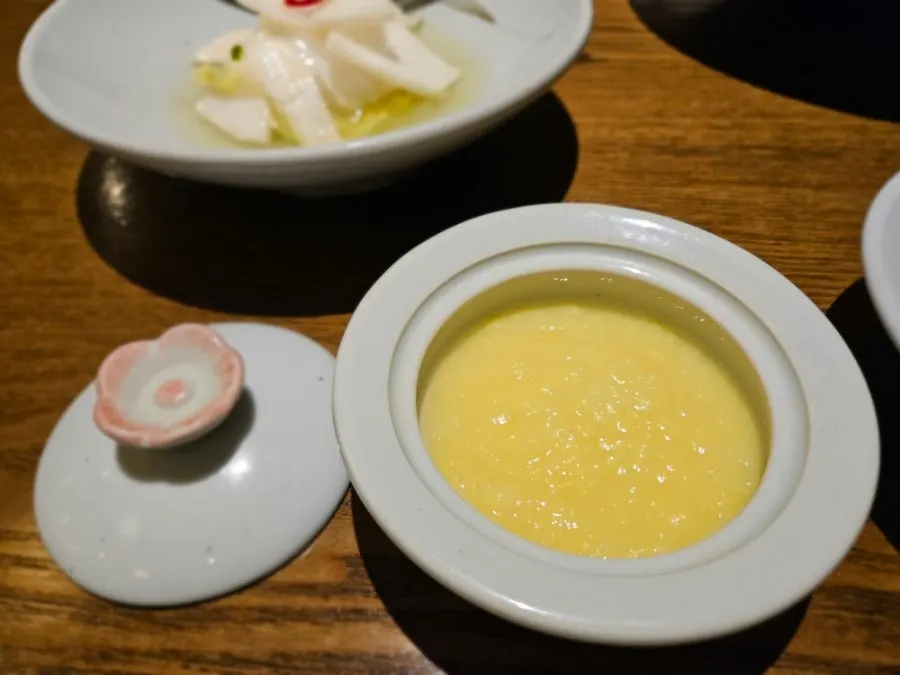A plate of clean, clearly fermented baek-kimchi and water kimchi