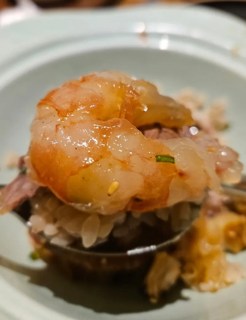 Close-up of abalone shrimp jang mixed into butter rice
