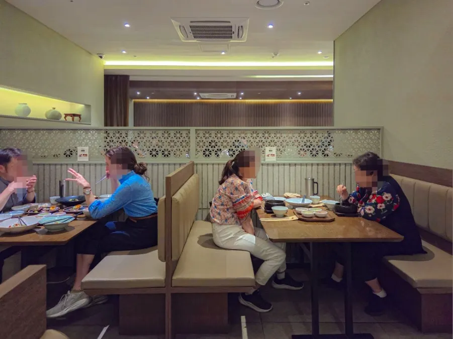 Interior of Modam Dining with white and wood-toned decor