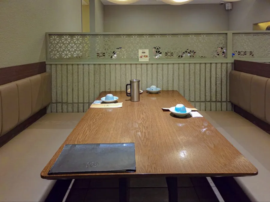 Hall seating with roomy table spacing at Modam Dining