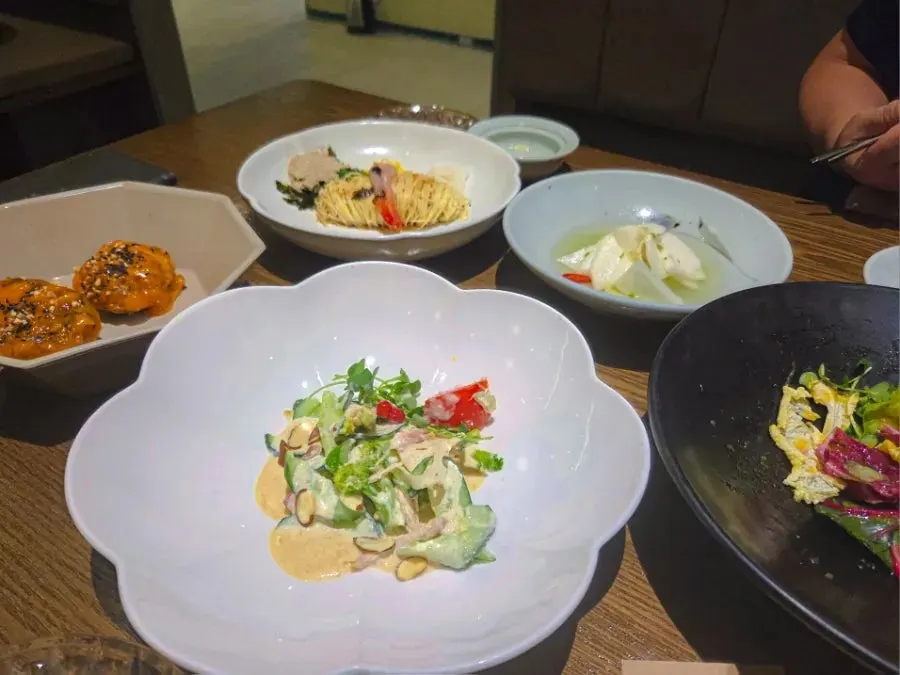 Table spread with seasonal porridge and starter dishes