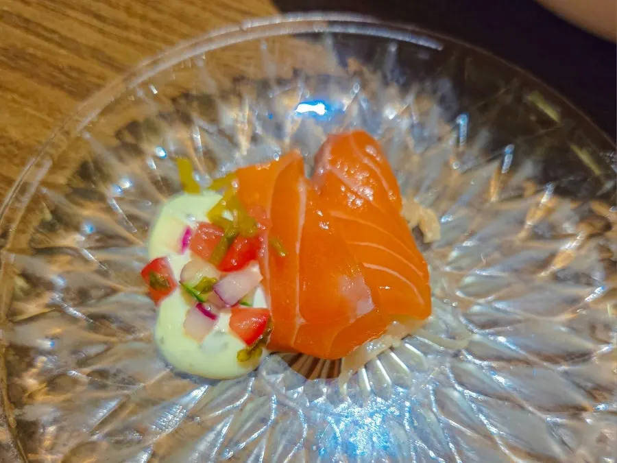 Salmon ceviche drizzled with ceviche sauce