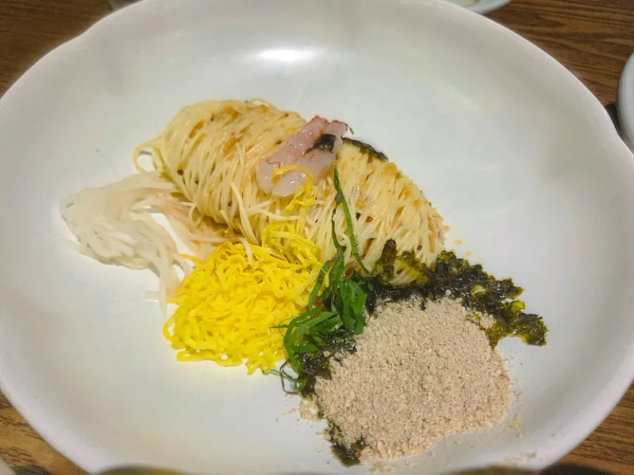 Perilla oil capellini topped with garnishes