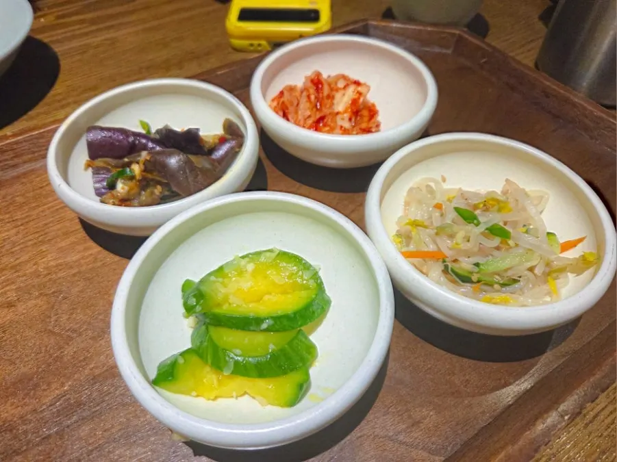 Side dishes including stir-fried eggplant, zucchini and bean sprouts