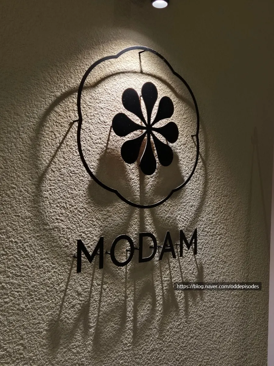 Menu display at the entrance of Modam Dining