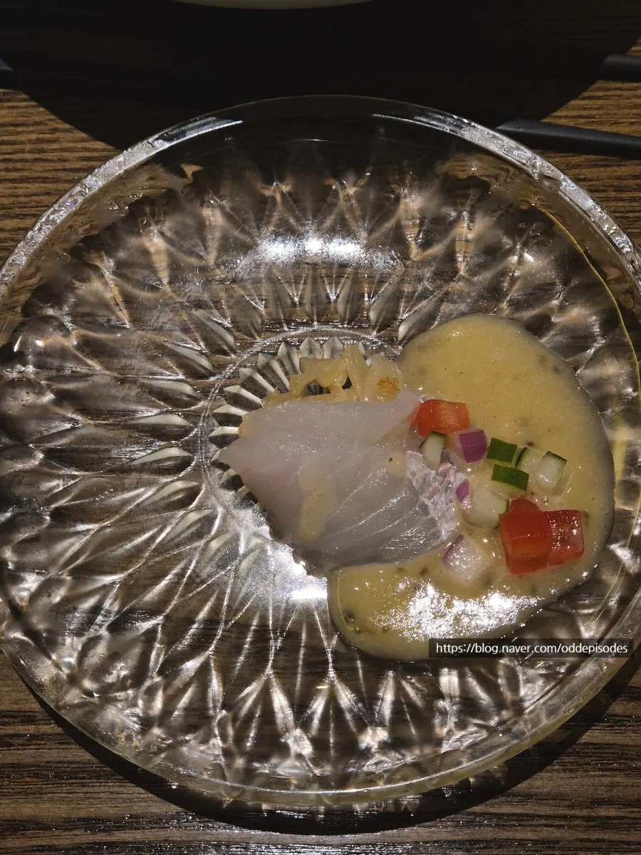 Seasonal salad with yuzu dressing and raw fish ceviche