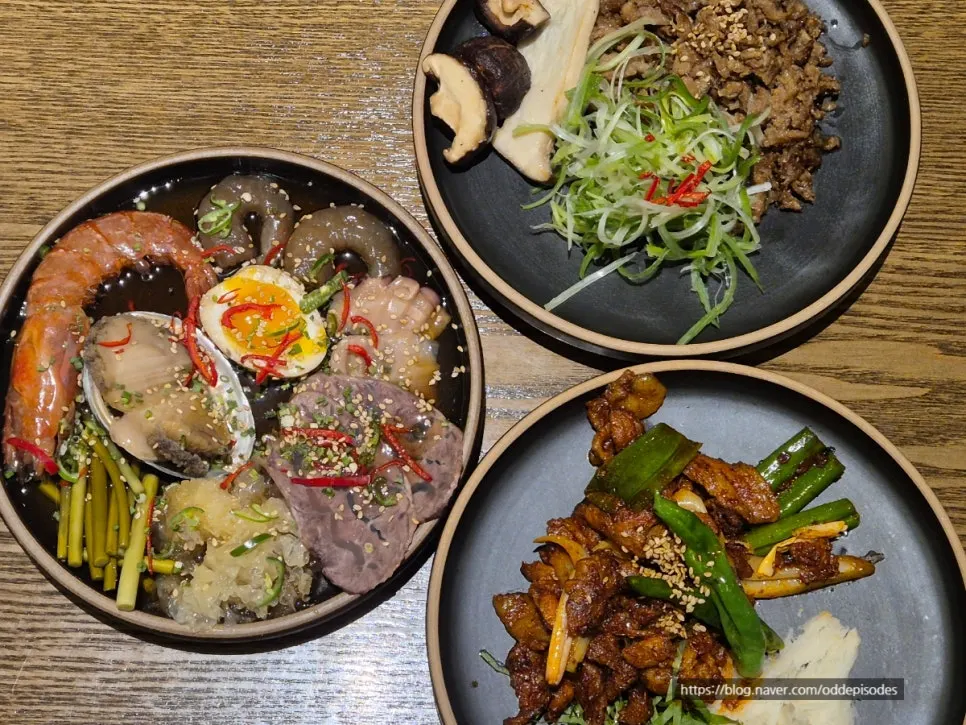 Main dishes from three set meals placed together on the table