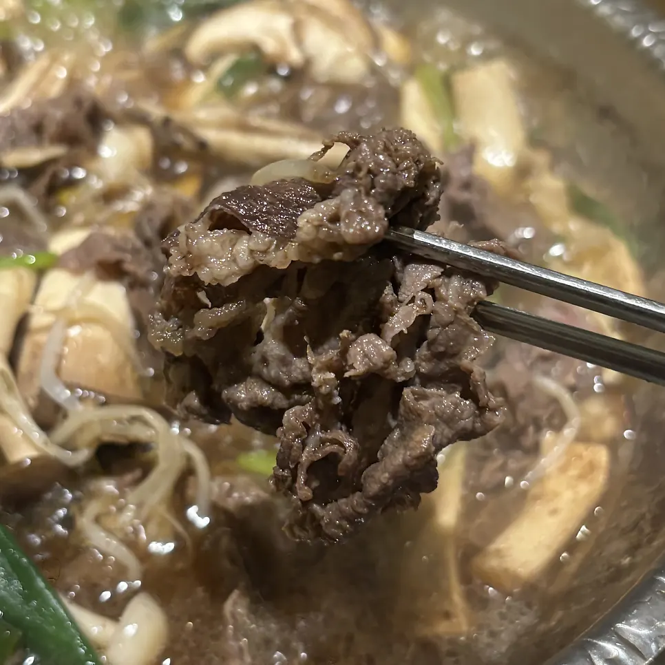 Korean beef bulgogi served with a bowl of white rice