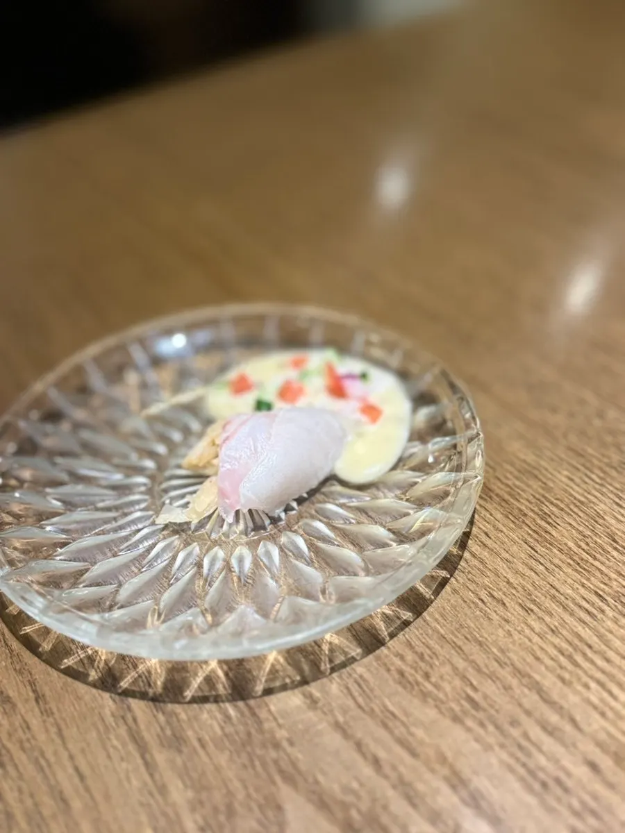 A plate of thickly sliced flounder sashimi