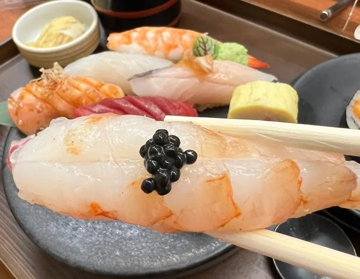Large raw shrimp and tuna sushi
